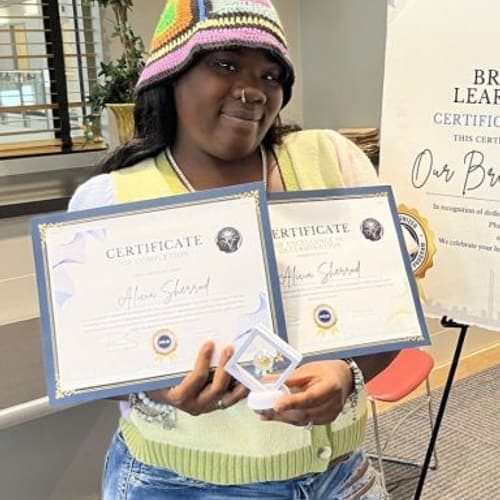 A Brilliantaires graduate on certification day