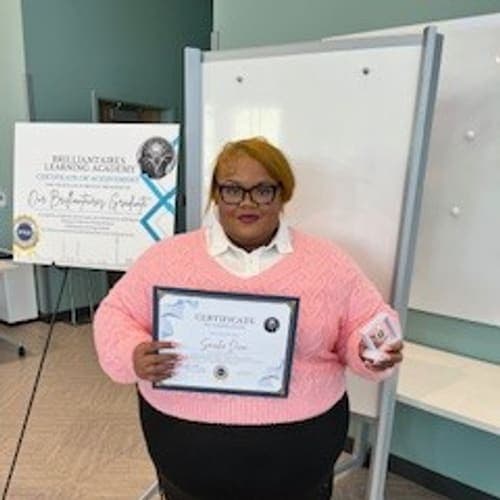 A Brilliantaires graduate on certification day
