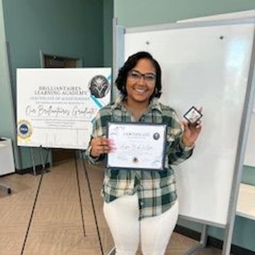 A Brilliantaires graduate on certification day