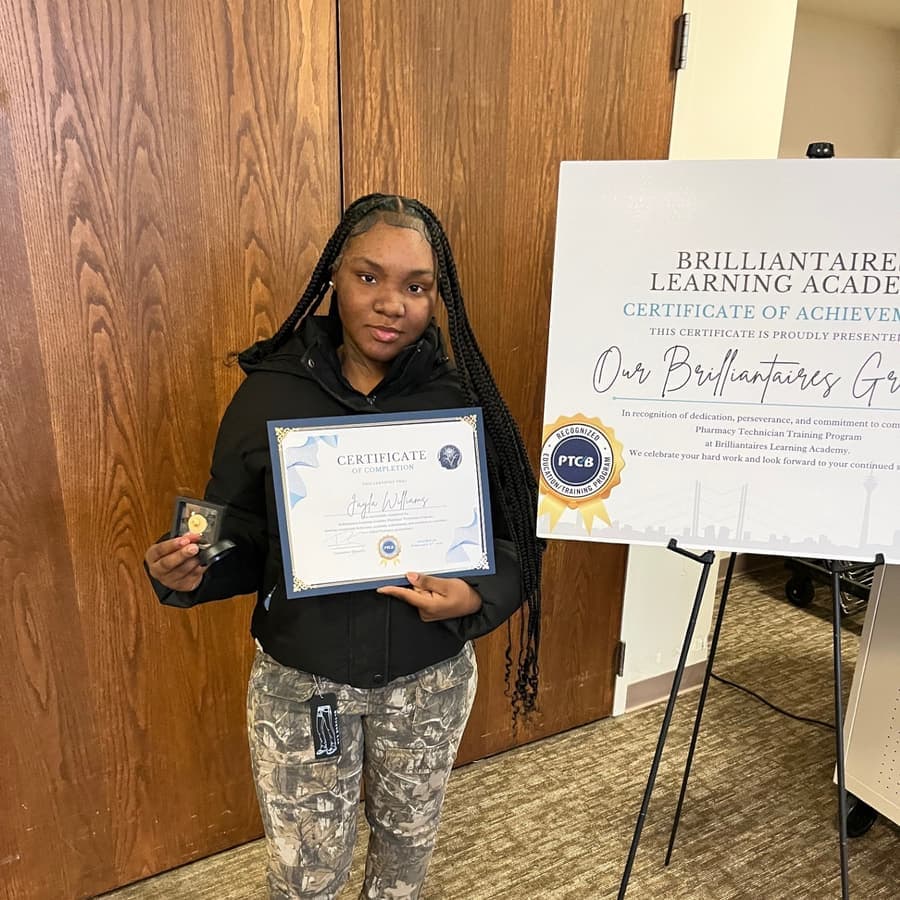 A Brilliantaires graduate celebrating with her certificate
